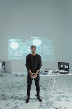 A man in a high-tech room with screens and money on the floor, suggesting cyber themes.