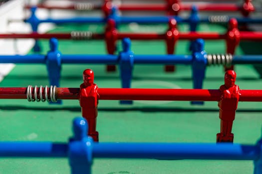 Vibrant foosball table with red and blue players in Buenos Aires, Argentina.